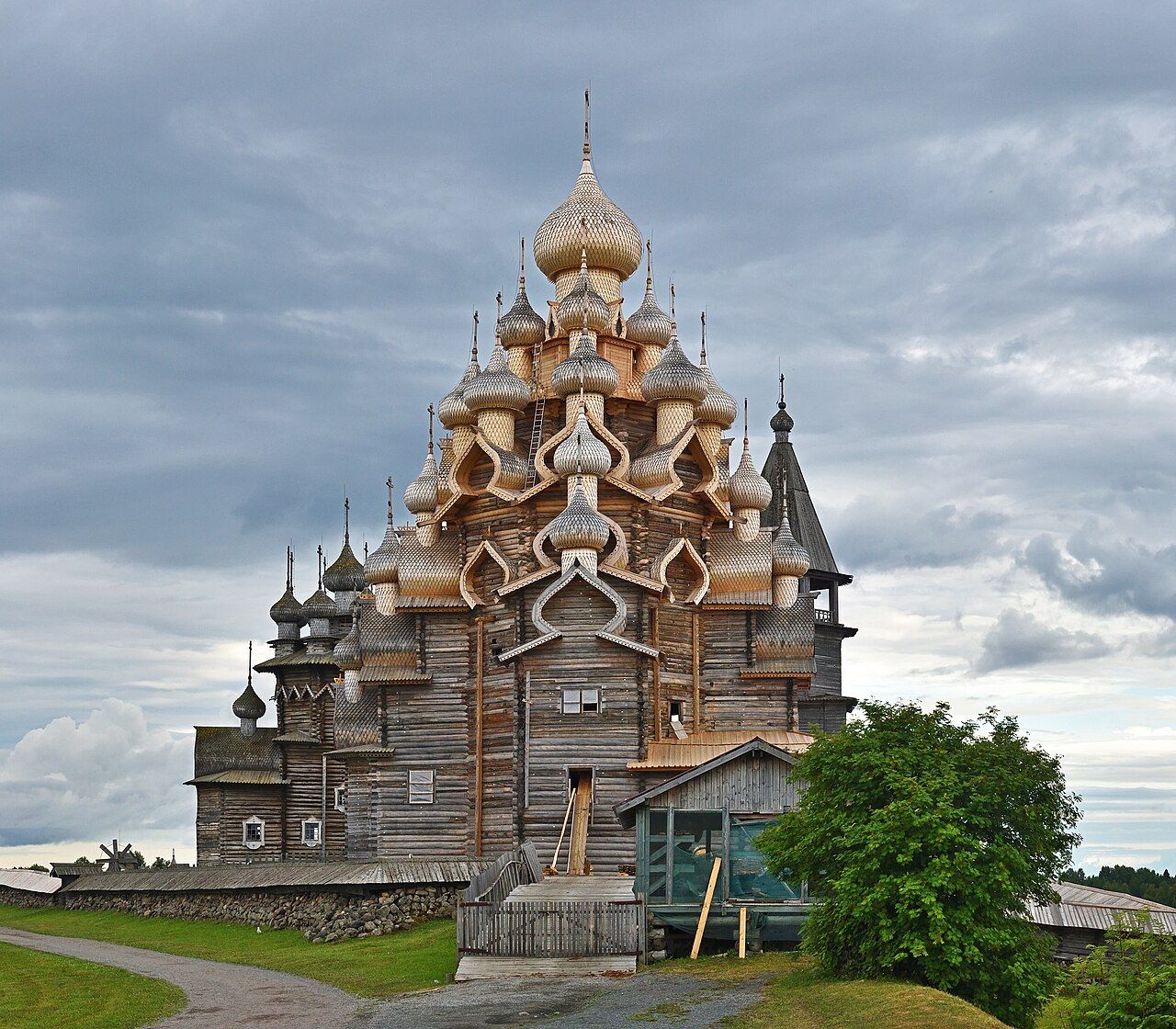 The 22-domed wooden Church of the Transfiguration on Kizhi Island under a cloudy sky